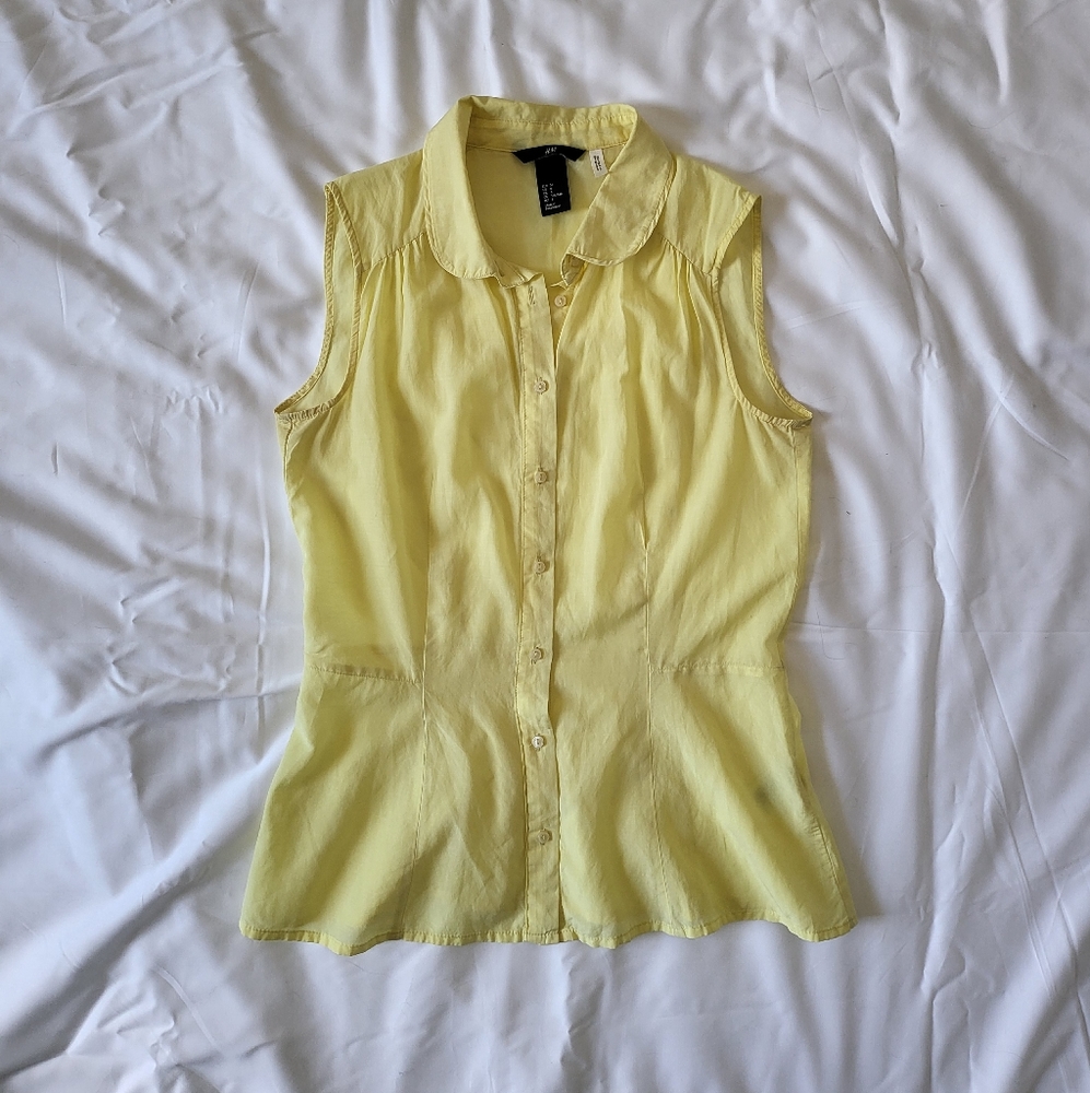 Light yellow sleeveless button down shirt, size 6